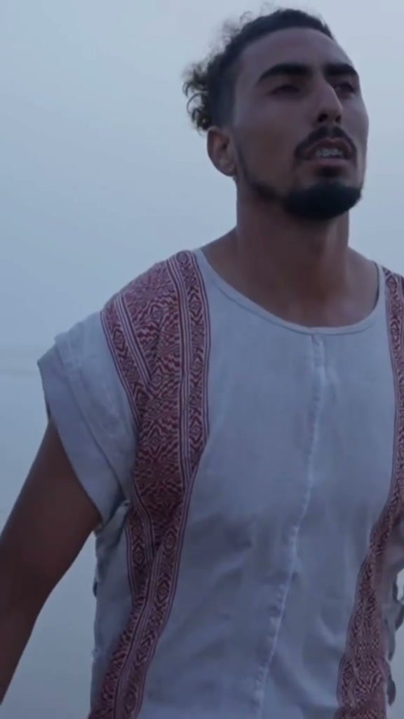 Man on a misty beach, from the Nomade film